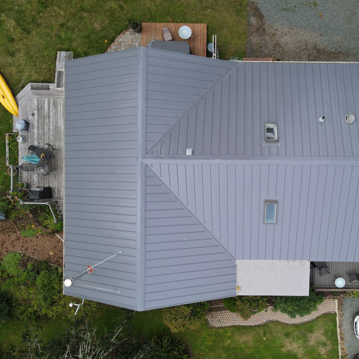 aerial top down view of residential property with metal roofing installed coos bay or