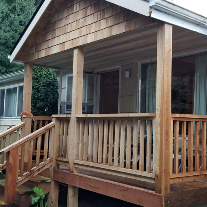 custom deck with railing installed at house front entrance coos bay or